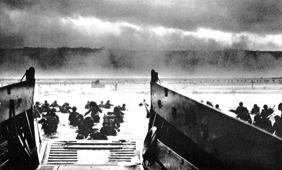 Rangers of the US 29th Division wading ashore under withering and deadly cross-fire on to Omaha Beach D-Day
